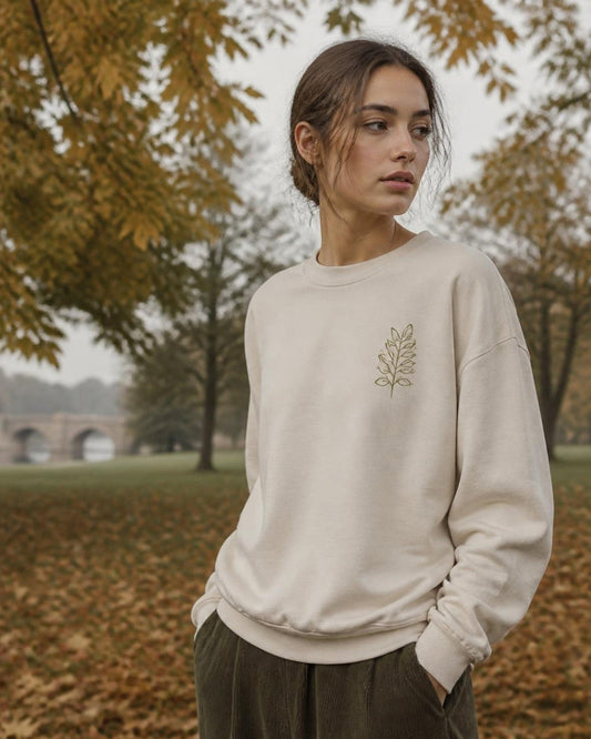 Woman in a printed organic cotton sweatshirt in an English park in autumn
